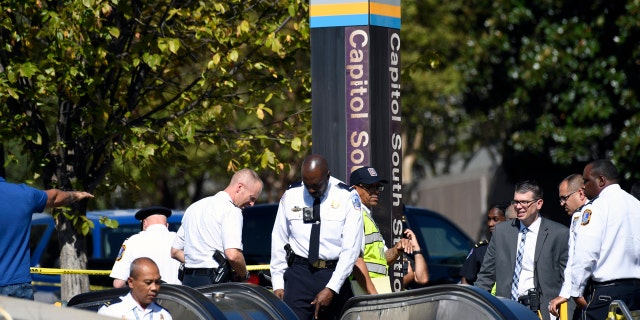 Officers respond to Friday's stabbing at the Capitol South Metro station. (AP Photo/Susan Walsh)
