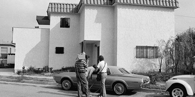 Newsmen examine the car of Dorothy Stratten, Playmate of the year 1980, after the nude bodies of her and her husband, Paul Snider, were found dead in this apartment in Los Angeles Aug. 14, 1980. Police said she was killed with a shotgun blast in the face, and Snider's body was on the floor on top of the gun.