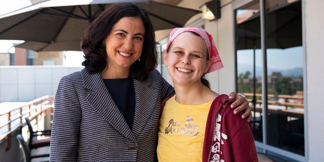 Dr. Bota, pictured with Johnson, said the experimental therapy crosses the brain barrier, which other cancer drugs have been unable to do.