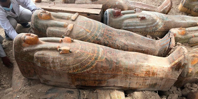 This photo provided by the Egyptian Ministry of Antiquities shows recently discovered coffins with inscriptions and paintings, in the southern city of Luxor.