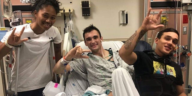 Sgt. Aechere Crump and Pfc. Victor Alamo visit with Spc. Ezra Maes during their recovery at Brooke Army Medical Center. Crump and Alamo survived the tank accident with Maes in early 2018. (Courtesy Photo)