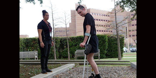 Candace Pellock, physical therapy assistant, with Spc. Ezra Maes at the Center for the Intrepid. (U.S. Army photo by Corey Toye)