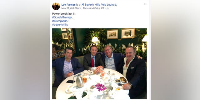 This Facebook screen shot provided by The Campaign Legal Center shows, from left, Donald Trump Jr., Tommy Hicks Jr., Lev Parnas and Igor Fruman, posted on May 21, 2018. (The Campaign Legal Center via AP)