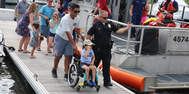 Giovanni Bacon, who is battling aggressive brain cancer, got to ride with the Coast Guard on Oct. 9. (Customs and Border Protection)