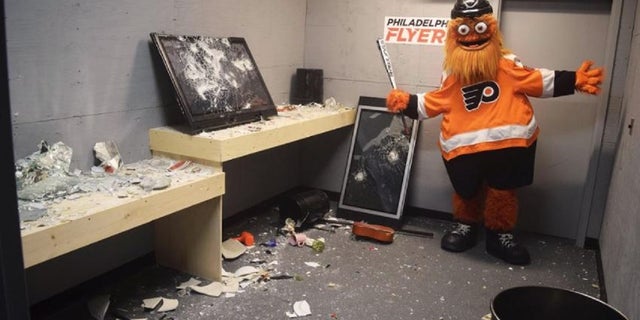 Philadelphia Flyers mascot Gritty poses after a session in the