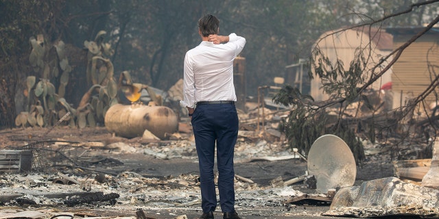 GEYSERVILLE, CA - OCT. 25: Gov. Gavin Newsom surveys a home destroyed in the Kincade Fire, Friday, Oct. 25, 2019, in Geyserville, Calif. (Karl Mondon/MediaNews Group/The Mercury News via Getty Images)