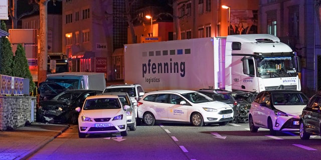 In this Monday, Oct. 7, 2019 photo s truck stands between damaged cars in Limburg, Germany.