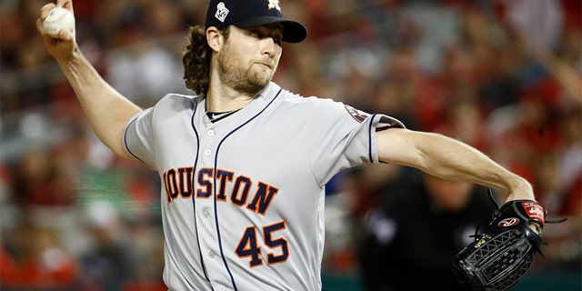 Houston Astros starting pitcher Gerrit Cole throws against the Washington Nationals during the first inning of Game 5 of the World Series on Sunday. (AP)