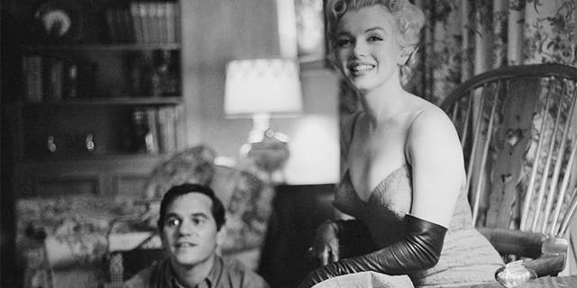 American actress Marilyn Monroe (1926 - 1962) with photographer Milton Green, 1955.