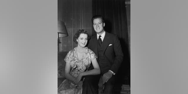 Viscount Althorp, son of the Earl and Countess Spencer, with his fiancee, 18-year-old Hon Frances Roche, daughter of Lord and Lady Fermoy, on the day before their wedding, 31st May 1954. They are the parents of Lady Diana Spencer, Princess of Wales.