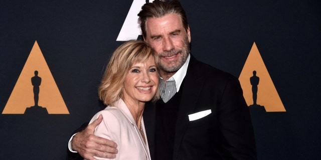 Olivia Newton-John starred in "Grease" alongside Kelly Preston's husband, John Travolta. The actress says the two are still in touch.