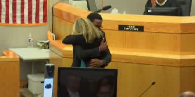 Botham Jean’s 18-year-old brother, Brandt, hugging Amber Guyger in court after saying he forgives her for killing his brother in an emotional victim impact statement.