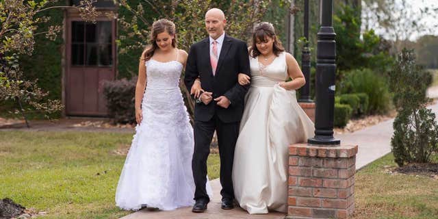 Pictures from the family’s daddy-daughter dances, which took place on Oct. 14, show Jason twirling and embracing his two teenage daughters. In one, he even walks them down the “aisle,” arm-in-arm.
