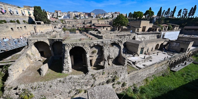 The archaeological site of Herculaneum in Ercolano, near Naples, with the Mount Vesuvius volcano in the background, on Oct. 23, 2019.