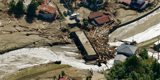 Driftwood is piled around a bridge after Typhoon Hagibis hits the town in Marumori, Miyagi prefecture, northern Japan Wednesday, Oct. 16, 2019.