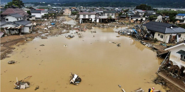 Residential area is flooded after an embankment of the Chikuma River broke due to Typhoon Hagibis, in Nagano, central Japan Tuesday, Oct. 15, 2019.