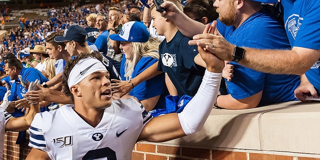 Brigham Young Cougars quarterback Jaren Hall  celebrates with fans after BYU defeated the Tennessee Volunteers 29-26 on September 7, 2019, at Neyland Stadium in Knoxville, Tennessee. (Photo by Bryan Lynn/Icon Sportswire via Getty Images)