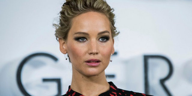 In this Dec. 1, 2016, file photo, actress Jennifer Lawrence poses for photographers during a photo call to promote the film "Passengers," in London. 