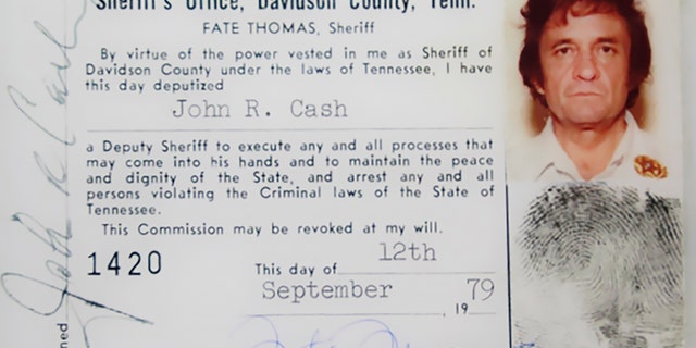 This 1979 image released by the Davidson County (Tenn.) Sheriff's Office via the Johnny Cash Museum, shows Cash's Deputy Sheriff ID card. This week at the Johnny Cash Museum in Nashville, Tenn., Nashville Sheriff Daron Hall unveiled a blown-up image of the late musician's September 1979 deputy sheriff commission card. The card authorized Cash to