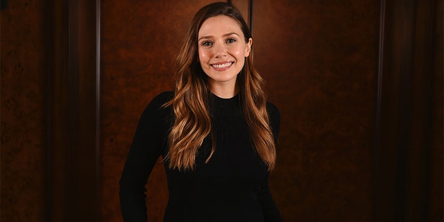 There's one habit Elizabeth Olsen refuses to give up on when it comes to traveling.