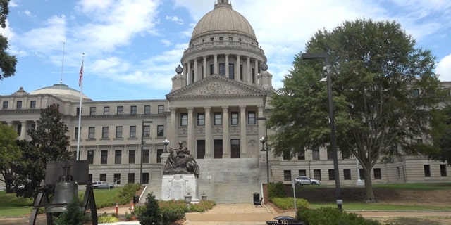 Outside of the Mississippi State House. Mississippi State Senator Michael Watson said that he has drafted new legislation in hopes to improve the state's E-verify mandate after ICE raids last summer.
