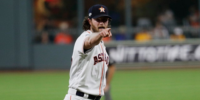 Houston Astros starting pitcher Gerrit Cole looks for a call against the Tampa Bay Rays during the first inning of Game 5 of a baseball American League Division Series in Houston, Thursday, Oct. 10, 2019. (AP Photo/Eric Gay)