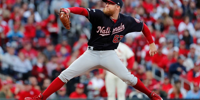 Washington Nationals relief pitcher Sean Doolittle throws during the eighth inning of Game 2 of the baseball National League Championship Series against the St. Louis Cardinals Saturday, Oct. 12, 2019, in St. Louis. 