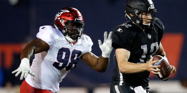 Corey Vereen #98 of the Memphis Express chases quarterback Luis Perez #12 of the Birmingham Iron during the third quarter of their Alliance of American Football game at Liberty Bowl Memorial Stadium on March 24, 2019 in Memphis, Tennessee. The Memphis Express won 31-25 in overtime.