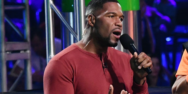 Host Michael Strahan participates in a challenge onstage during Nickelodeon Kids' Choice Sports 2019 at Barker Hangar on July 11, 2019 in Santa Monica, Calif. (Photo by Emma McIntyre/KCASports2019/Getty Images for Nickelodeon )