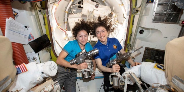 In this photo released by NASA on Thursday, Oct. 17, 2019, U.S. astronauts Jessica Meir, left, and Christina Koch, pose for a photo in the International Space Station.