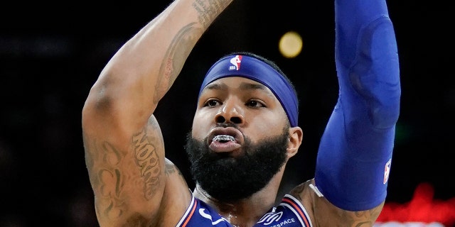 New York Knicks forward Marcus Morris shoots during the first half of the team's NBA basketball game against the San Antonio Spurs, Wednesday, Oct. 23, 2019, in San Antonio. San Antonio won 120-111. (AP Photo/Darren Abate)
