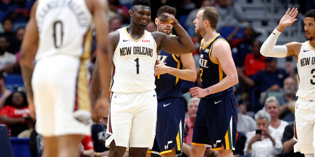 New Orleans Pelicans forward Zion Williamson (1) reacts after scoring a basket against the Utah Jazz during the second half of a preseason NBA basketball game in New Orleans, Friday, Oct. 11, 2019. The Pelicans won 128-127. (AP Photo/Tyler Kaufman)