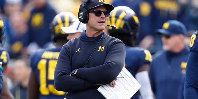 FILE - In this Saturday, Oct. 5, 2019, file photo, Michigan head coach Jim Harbaugh watches during the second half of an NCAA college football game against Iowa in Ann Arbor, Mich. Harbaugh sent an email to parents of players on his team, refuting a report saying representatives are working on his departure from the school. (AP Photo/Paul Sancya, File)