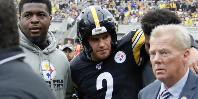 Pittsburgh Steelers quarterback Mason Rudolph (2) is helped from the field after he was injured in the second half of their game against the Baltimore Ravens, Sunday, Oct. 6, 2019, in Pittsburgh. 
