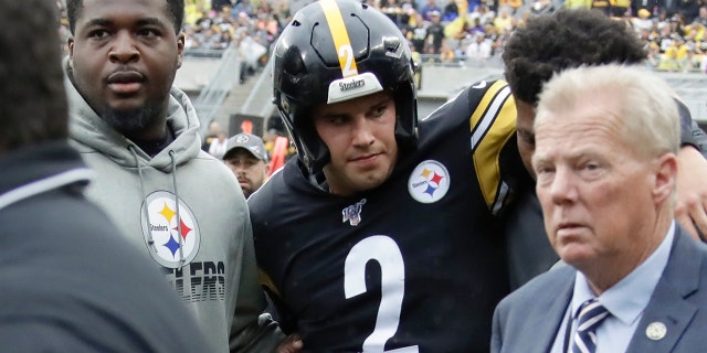 Pittsburgh Steelers quarterback Mason Rudolph (2) is helped from the field after he was injured in the second half of their game against the Baltimore Ravens, Sunday, Oct. 6, 2019, in Pittsburgh.