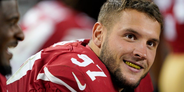 San Francisco 49ers defensive end Nick Bosa (97) smiles on the sideline during the second half of an NFL football game against the Cleveland Browns in Santa Clara, Calif., Monday, Oct. 7, 2019. (AP Photo/Tony Avelar)