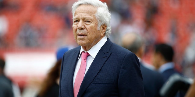 New England Patriots owner Robert Kraft walks the turf ahead of an NFL football game between the Washington Redskins and the New England Patriots, Sunday, Oct. 6, 2019, in Washington.