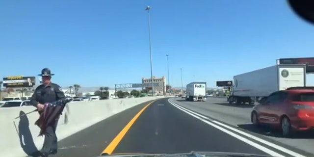 Nevada Police Officer Saves American Flag From Side Of Las Vegas