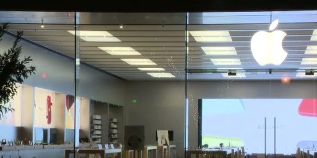 A suspected burglar was shot and killed by a security guard in an Apple store early Tuesday, according to police.