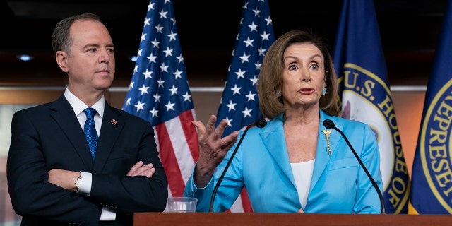Speaker of the House Nancy Pelosi, D-Calif., is joined by House Intelligence Committee Chairman Adam Schiff, D-Calif., at a news conference as House Democrats move ahead in the impeachment inquiry of President Donald Trump, at the Capitol in Washington, Wednesday, Oct. 2, 2019. (AP Photo/J. Scott Applewhite)