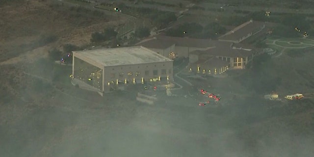 Smoke from the Easy Fire can be seen shrowding the Ronald Reagan Presidential Library and Museum in Simi Valley, Calif.