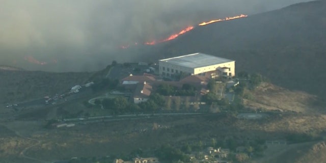 Flames could be seen on the hills near the Ronald Reagan Presidential Library in Simi Valley, Calif.