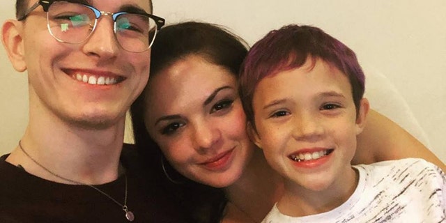 Rogers, pictured with her sons before the accident, said she is still dealing with nerve pain in her arms and legs.