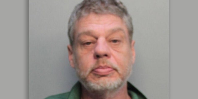 Russel Ewing, 53, is accused of killing his wife and leaving her body in their Miami Beach apartment for more than a week, according to police. He was arrested on Wednesday after surrendering to SWAT officers.