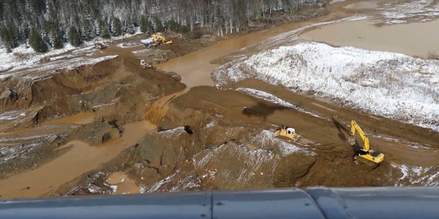 At least 15 people are dead after a dam at a small Siberian gold mine collapsed and water flooded two workers' dormitories on Saturday.
