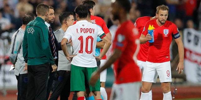 England manager Gareth Southgate, third left, speaks with Referee Ivan Bebek during the Euro 2020 group A qualifying soccer match between Bulgaria and England, at the Vasil Levski national stadium, in Sofia, Bulgaria, Monday, Oct. 14, 2019. (AP Photo/Vadim Ghirda)
