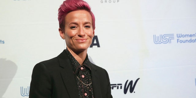 In this Wednesday, Oct. 16, 2019, photo soccer star Megan Rapinoe poses for photos on the red carpet of the Women's Sports Foundation's 40th annual Salute to Women in Sports in New York. Rapinoe, who was honored at the gala, won Sportswoman of the Year in the team category. She led the U.S. women's soccer team to victory at the World Cup in France and earned the FIFA Player of the Year award. (AP Photo/Mary Altaffer)