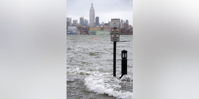 The Hudson River swells over the Hoboken, New Jersey waterfront on October 29, 2012 as Hurricane Sandy approaches.