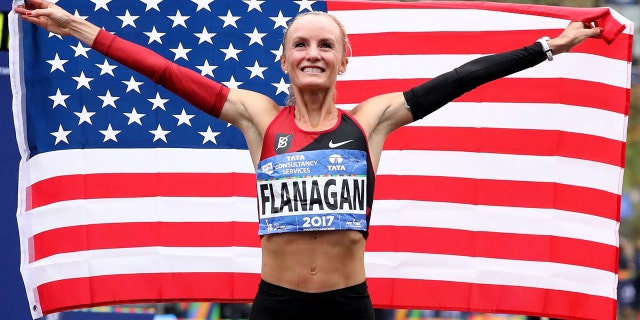 Shalane Flanagan celebrates becoming the first American woman to win the New York City Marathon since 1977 in November 2017.