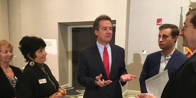 Former Democratic presidential candidate and current U.S. Senate candidate, Montana Gov. Steve Bullock mingles with the crowd after headlining the 'Politics and Eggs' speaking series, in Manchester, NH on Oct. 11, 2019